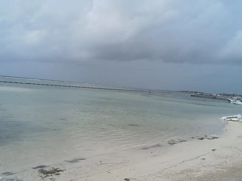 Mahahual beach and pier on a calm cloudy morning