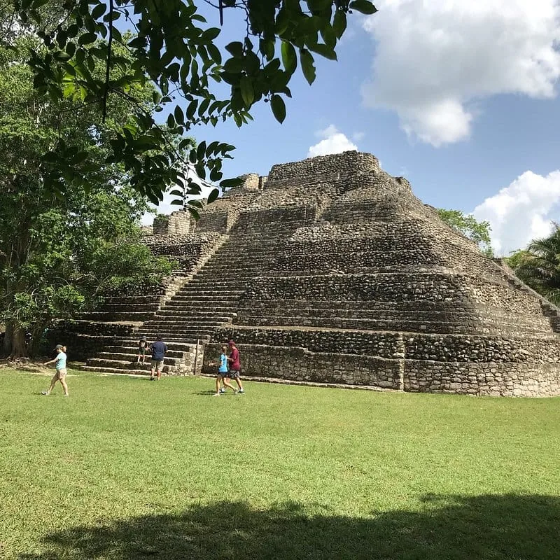 Wide view of the Chacchoben archaeological site with visitors