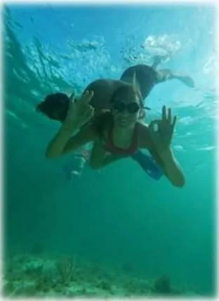 Guest snorkeling over the reef on our Mahahual snorkeling tour